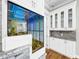 White built-in cabinets with granite countertop at 4260 Columbus Dr, Hernando Beach, FL 34607