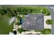 Aerial view of waterfront home with pool and dock at 4260 Columbus Dr, Hernando Beach, FL 34607