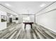 Spacious game room, featuring a pool table and wet bar at 4260 Columbus Dr, Hernando Beach, FL 34607
