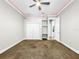Bright bedroom featuring a ceiling fan and carpet flooring at 4260 Columbus Dr, Hernando Beach, FL 34607