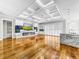 Spacious great room with hardwood floors, coffered ceiling, fireplace and large TV at 4260 Columbus Dr, Hernando Beach, FL 34607