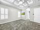 Media room with coffered ceiling and large windows at 4260 Columbus Dr, Hernando Beach, FL 34607