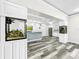 Basement wet bar with stone backsplash and fish tank at 4260 Columbus Dr, Hernando Beach, FL 34607