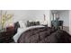 Comfortable bedroom featuring a well-made bed and warm, inviting decor at 2207 Belleair Rd # A32, Clearwater, FL 33764