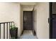 Inviting front entryway with a secure brown door and neutral textured walls at 2207 Belleair Rd # A32, Clearwater, FL 33764