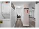 Hallway view showcasing convenient in-unit laundry and access to living spaces at 2207 Belleair Rd # A32, Clearwater, FL 33764