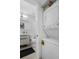 The in-unit laundry area showcases a stacked washer and dryer, maximizing space at 2207 Belleair Rd # A32, Clearwater, FL 33764