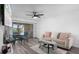 Inviting living room with sliding glass doors and elegant dining area at 2207 Belleair Rd # A32, Clearwater, FL 33764