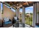 Relaxing sunroom with comfortable seating, a ceiling fan, and natural light at 2207 Belleair Rd # A32, Clearwater, FL 33764