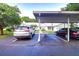 Parking space with two cars parked at 2727 Featherstone Dr # 2727, Holiday, FL 34691