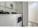 Clean laundry area with modern washer and dryer at 2727 Featherstone Dr # 2727, Holiday, FL 34691