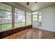 Sun room with floor to ceiling windows at 2727 Featherstone Dr # 2727, Holiday, FL 34691
