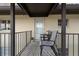 View of a balcony space with a table set and a zebra-print outdoor rug at 4632 Marine Pkwy # 302, New Port Richey, FL 34652