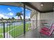 Inviting balcony with seating overlooking the tranquil water and lush landscaping at 4632 Marine Pkwy # 302, New Port Richey, FL 34652