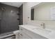 Beautifully renovated bathroom featuring modern vanity, fixtures, and walk-in shower with tile surround at 4632 Marine Pkwy # 302, New Port Richey, FL 34652