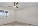 Neutral-toned bedroom with light wood floors, a window with shutters, and a ceiling fan at 4632 Marine Pkwy # 302, New Port Richey, FL 34652