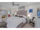 Spacious and stylishly furnished bedroom with ample natural light and comfortable decor at 4632 Marine Pkwy # 302, New Port Richey, FL 34652