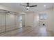Large bedroom with mirrored closet and views to bright window and doorway at 4632 Marine Pkwy # 302, New Port Richey, FL 34652