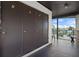 Exterior storage with numbered doors and a view of the water and blue sky at 4632 Marine Pkwy # 302, New Port Richey, FL 34652