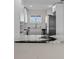 Modern kitchen with stainless steel appliances and bright white cabinets at 4632 Marine Pkwy # 302, New Port Richey, FL 34652
