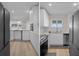 Modern kitchen with white cabinetry, stainless steel appliances, and a bright, airy feel at 4632 Marine Pkwy # 302, New Port Richey, FL 34652