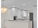 Modern kitchen with marble counters, white cabinets and stainless steel appliances at 4632 Marine Pkwy # 302, New Port Richey, FL 34652