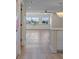 Bright living room with hardwood floors, ceiling fan and lots of natural light from windows at 4632 Marine Pkwy # 302, New Port Richey, FL 34652