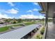View of the parking area with assigned covered parking and views of the community at 4632 Marine Pkwy # 302, New Port Richey, FL 34652