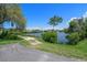 View of community water area with mature trees, landscaping and nature at 4632 Marine Pkwy # 302, New Port Richey, FL 34652