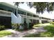 Well maintained building exterior with lush landscaping at 1955 Abrico Dr # G7, Lutz, FL 33558