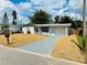 Single story home with a driveway and landscaped yard at 3418 Devonshire Dr, Holiday, FL 34691