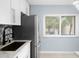 Modern kitchen with stainless steel appliances and updated sink at 2207 Belleair Rd # A32, Clearwater, FL 33764