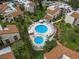 Aerial view of community pool and surrounding buildings at 2207 Belleair Rd # A32, Clearwater, FL 33764