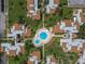 Aerial view of community pool and surrounding buildings at 2207 Belleair Rd # A32, Clearwater, FL 33764