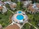 Community pool with patio furniture and landscaping at 2207 Belleair Rd # A32, Clearwater, FL 33764