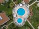 Community pool with two spas and surrounding patio at 2207 Belleair Rd # A32, Clearwater, FL 33764