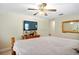 Main bedroom with large TV and comfortable sleeping arrangements at 11193 Baltimore St, Weeki Wachee, FL 34614