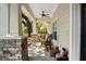 Inviting front porch with rocking chairs and stone pillars at 11193 Baltimore St, Weeki Wachee, FL 34614