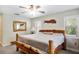 Main bedroom showcasing a rustic wood bed frame and natural light at 11193 Baltimore St, Weeki Wachee, FL 34614