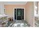 Elegant front entrance with a dark wood door and glass accents at 11193 Baltimore St, Weeki Wachee, FL 34614