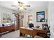 Home office with built-in shelving and plenty of natural light at 11193 Baltimore St, Weeki Wachee, FL 34614