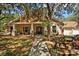 House exterior with porch and landscaping at 11193 Baltimore St, Weeki Wachee, FL 34614