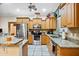 Spacious kitchen with granite countertops and stainless steel appliances at 11193 Baltimore St, Weeki Wachee, FL 34614