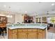 Kitchen island with granite countertop, offering extra workspace and seating at 11193 Baltimore St, Weeki Wachee, FL 34614