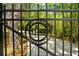 Ornate metal entrance gate with address at 11193 Baltimore St, Weeki Wachee, FL 34614