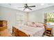 Bedroom with a wooden bed frame and ample natural light at 11193 Baltimore St, Weeki Wachee, FL 34614