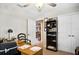 Spacious home office with a desk and built-in bookshelf at 11193 Baltimore St, Weeki Wachee, FL 34614