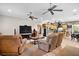 Open living room with comfortable seating and a large TV at 11193 Baltimore St, Weeki Wachee, FL 34614