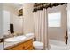 Clean bathroom featuring a shower/tub combo and granite vanity at 11193 Baltimore St, Weeki Wachee, FL 34614