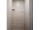 Clean shower with neutral tile and simple shelving at 11193 Baltimore St, Weeki Wachee, FL 34614